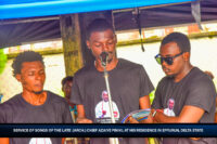 Ebisinde Azaiye (M) reading his late father's biography