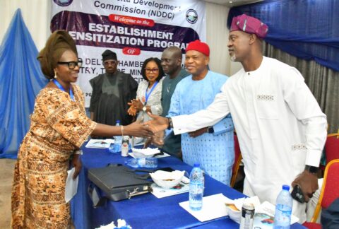 The President, Akure Chamber of Commerce, Industry, Mines and Agriculture, Mrs. Funmilayo Ade-ojo, (left), in a handshake with the Ondo State Representative on NDDC, Hon. Otito Atikase, (right), during the NDCCITMA sensitisation workshop in Akure, Ondo State.