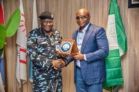 The NDDC Managing Director, Dr. Samuel Ogbuku (right), presenting a plaque to the River State Commissioner of Police, Mr. Mustapha Mohammed (left), during a courtesy visit, at the Commission headquarters in Port Harcourt.