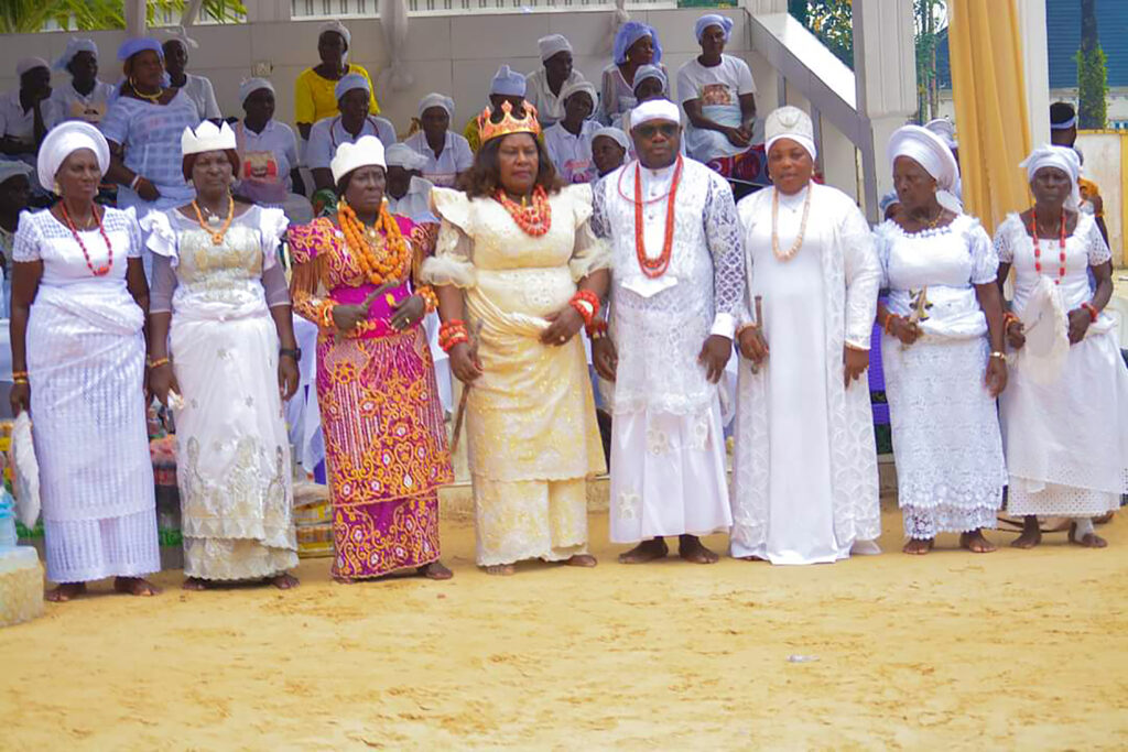 Dr Dennis Otuaro in a group photograph with High Priestesses of various deities in Oporoza 