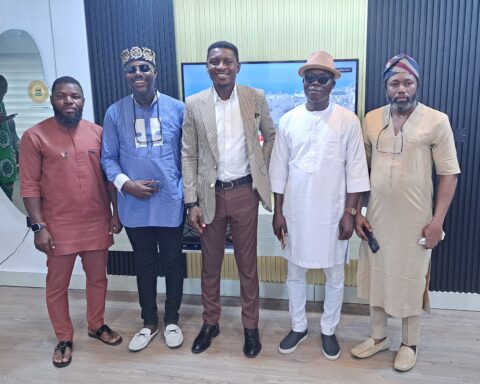 The IPF delegation led by Comrade Ozobo Austin, and committee members in a group photograph with Comr. Kemepado Alfred the Bayelsa Commissioner for Youth during the meeting.