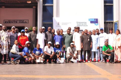 Hon. Igoin Peter Tokoni, the Special Assistant to the President on ICT Development and Digital, special guests and speakers in a photograph with the beneficiaries shortly after the programme