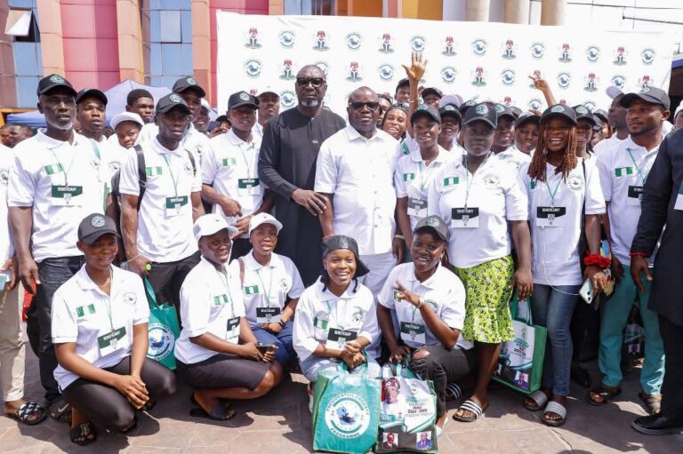 Dr Dennis Brutu Otuaro in a group photograph with the scholarship beneficiaries shortly after the event